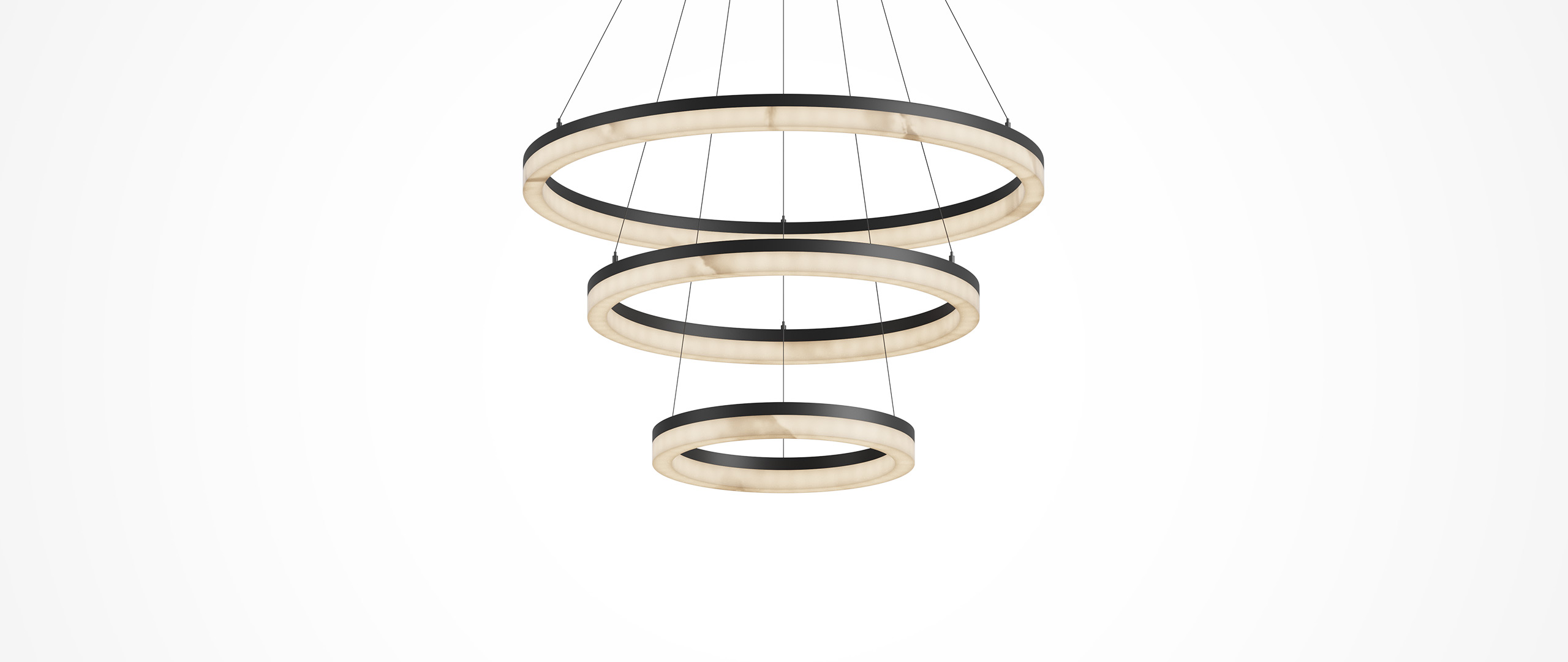 Alabaster lighting poster: Three rings suspend light; alabaster glows.